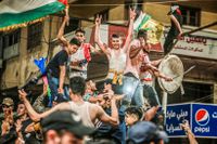 Palestinier firar beslutet om eldupphör.