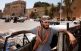 Mohamed Youssef blickar ut över gröna torget, som numera återdöpts till Martyrtorget, i Tripoli. Få civila vågade sig ut i Libyens huvudstad på onsdagen.