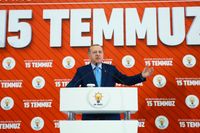 President Recep Tayyip Erdogan deltog på fredagen i en ceremoni inför årsdagen av det misslyckade kuppförsöket. Samtidigt annonserades nya massavskedanden.