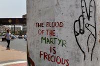 Citat från den sudanesiska oppositionen klottrat på en vägg i huvudstaden Khartum efter oroligheterna den 3 juni då dussintals människor dödades. Arkivfoto.