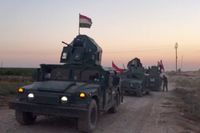 Bilden, från en video, uppges visa irakiska militärfordon på väg mot Kirkuk på måndagen.