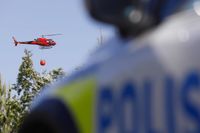 Två helikoptrar har kallats in för att vattenbomba branden nära Arlanda flygplats.