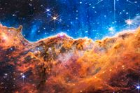  Bilden visar kanten på ett stort moln av gas och rymdstoft från universums ungdom. I den så kallade nebulosan bildas nya stjärnor. 