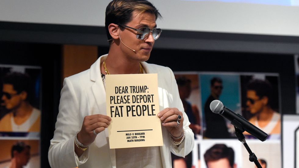 Milo Yiannopoulos holds a sign as he speaks at the University of Colorado campus in Boulder, Colo., Wednesday, Jan. 25, 2017. Yiannopoulos is an editor at the alt-right website Breitbart News. The alt-right is an offshoot of conservatism mixing racism, white nationalism and populism. 
