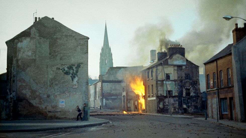  In this February 1972 file photo, a building burns in the bogside district of Londonderry, Northern Ireland, in the aftermath of Bloody Sunday, one of the the most notorious events of The Troubles. Time has not completely healed the hatred, distrust and fear of those caught up in the decades-long conflict.
