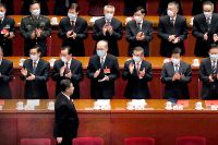 Kinas president Xi Jinping får applåder under den 13:e nationella folkkongressen i Peking den 11 mars i år. 