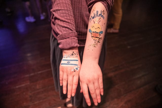 A ten-year-old shows his paintings, which pay tribute to the dead ten-year-old victim Matilda, also called