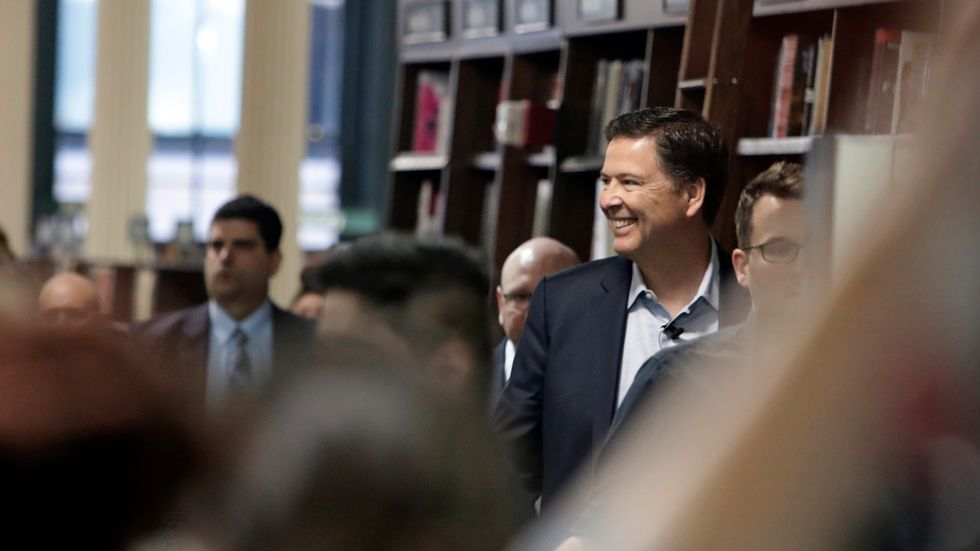  Former FBI director James Comey arrives at a Barnes & Noble book store to speak to an audience Wednesday, April 18, 2018, in New York.  