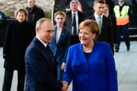 Vladimir Putin och Angela Merkel.