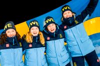 Sveriges Linn Persson, Mona Brorsson, Hanna Öberg och Elvira Öberg jublar efter att de tagit OS-guld i damernas stafett i skidskytte under vinter-OS i Peking.