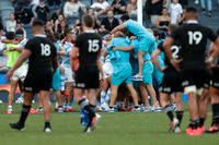 Argentinas spelare jublar efter den oväntade segern mot Nya Zeeland i Parramatta utanför Sydney i Australien på lördagen.