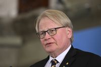 En man i 60-årsåldern har åtalats för att ha dödshotat försvarsminister Peter Hultqvist via mejl.