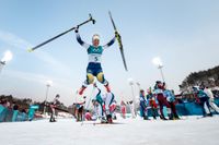 Charlotte Kalla tog OS-guld i skiathlon.