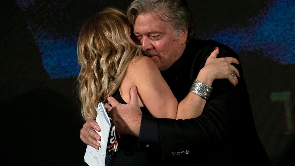  Steve Bannon hugs Giorgia Meloni, leader of the Fratelli d'Italia (Brothers of Italy) party, at a forum in Rome, Saturday, Sept. 22, 2018. Former Trump strategist Steve Bannon declared Saturday that far-right "patriots" are the "new elite" of Europe as he brought his push for a trans-national, anti-European Union drive to Italy. The ex-aide to U.S. President Donald Trump addressed a forum in Rome organized by a small far-right Italian opposition party. Bannon was asked if there should be a new "elite" in growing, far-right populist movements. His reply? The "new elite in this populist movement are the patriots" in society. 