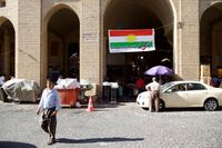 En kampanjflagga i Arbil manar folket att rösta ja till självständighet för irakiska Kurdistan.