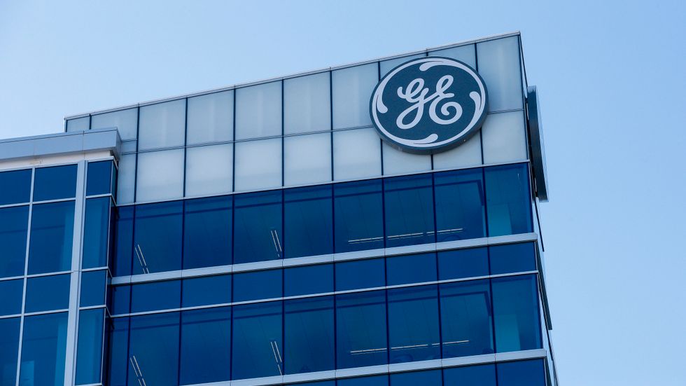 General Electric pressas globalt av vikande orderingång. Arkivbild.