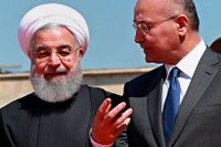 Irans president Hassan Rouhani, vänster, möter Iraks dito Barham Salih den 11 mars 2019 i Bagdad.