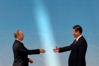 Vladimir Putin och Xi Jinping under en konferens i Shanghai för ökat asiatiskt samarbete.