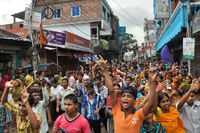 Textilarbetare i Narayanganj, nära Dhaka i Bangladesh, protesterar mot de låga lönerna i september i år.